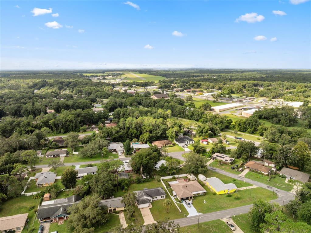 1221 Emerson Street Inverness, FL 34450 - Photo 36 of 39 an aerial view of residential houses with outdoor space and trees