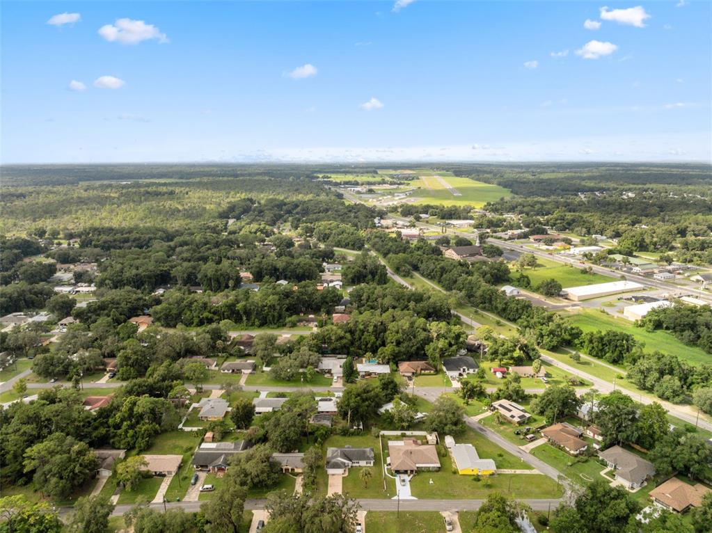 1221 Emerson Street Inverness, FL 34450 - Photo 37 of 39 an aerial view of residential houses with outdoor space and trees
