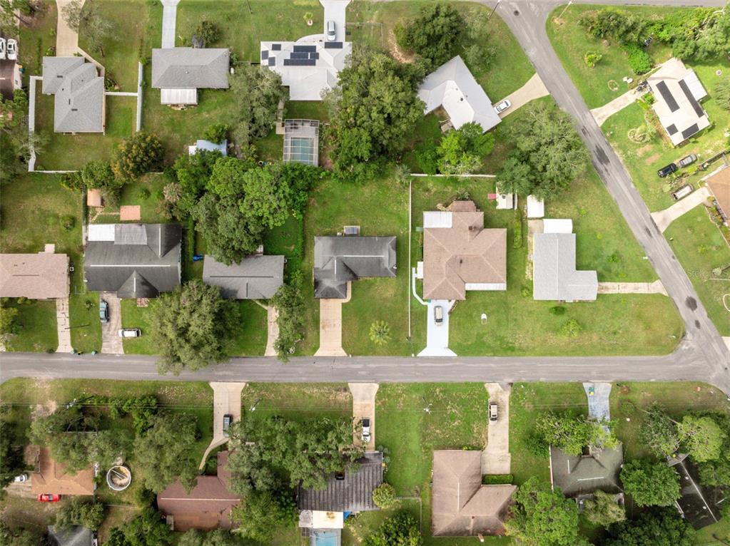 1221 Emerson Street Inverness, FL 34450 - Photo 38 of 39 an aerial view of multiple houses with yard