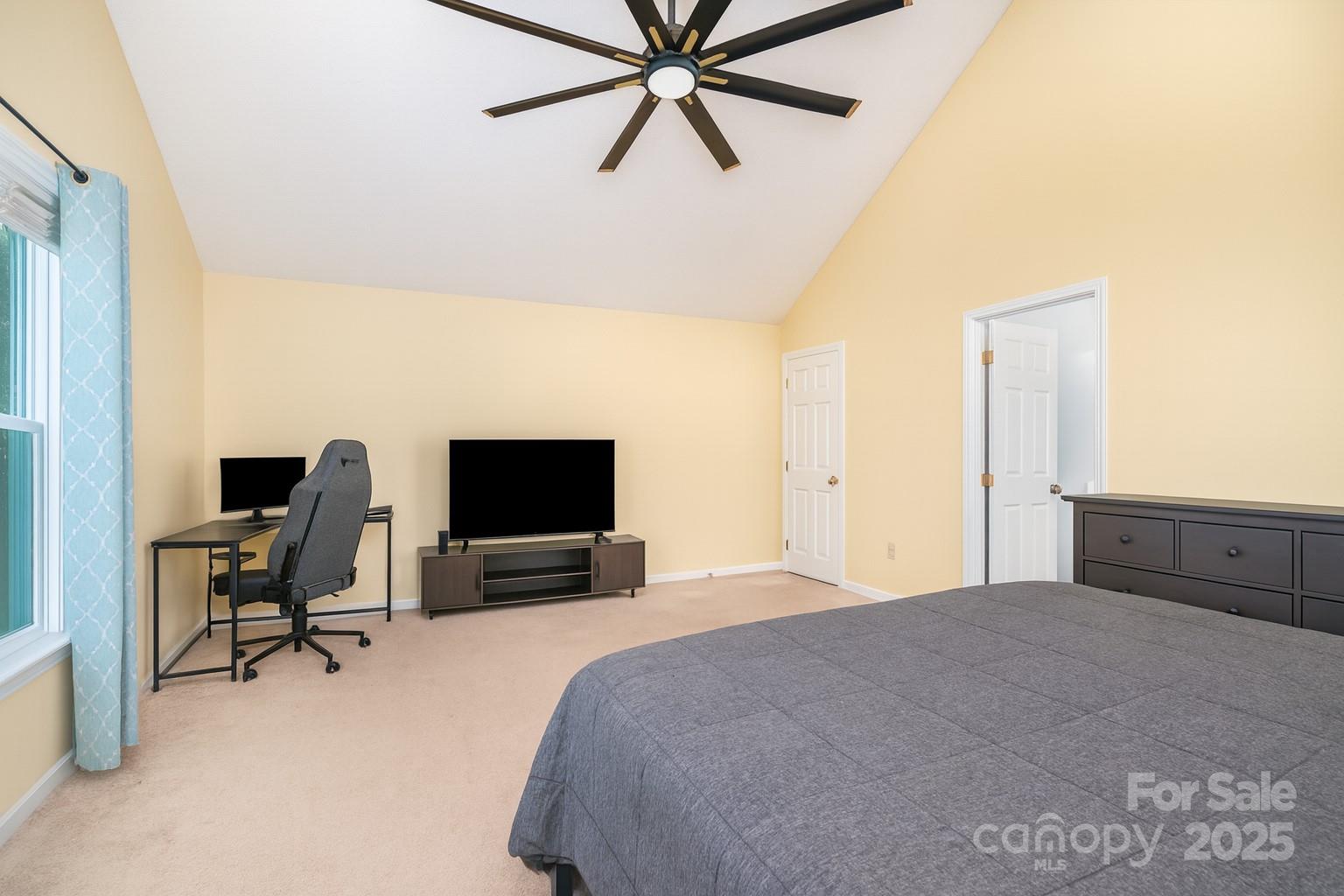 245 Castle Keep Road Salisbury, NC 28146 - Photo 14 of 26 a bedroom with a bed window and a flat screen tv