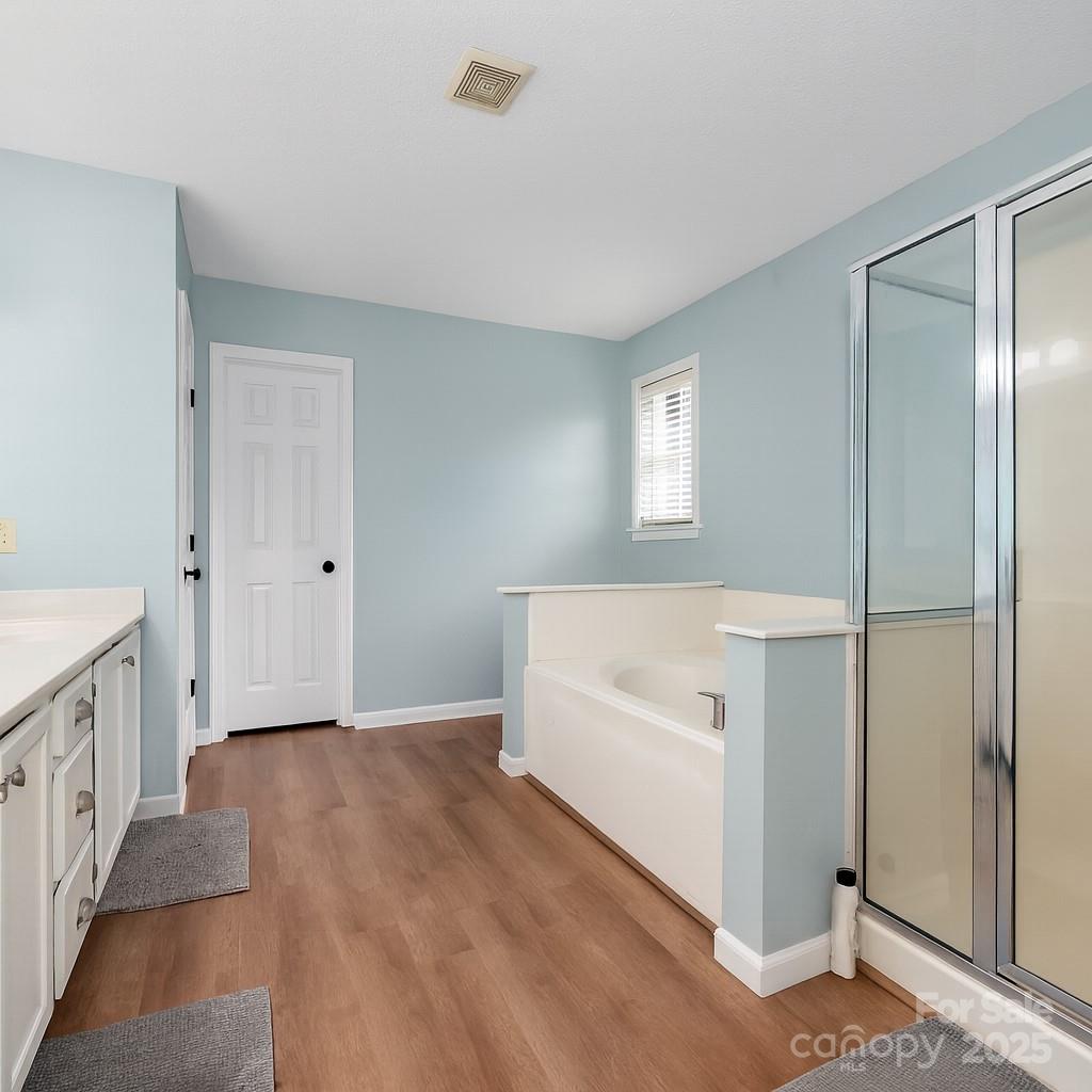 245 Castle Keep Road Salisbury, NC 28146 - Photo 18 of 26 a spacious bathroom with a bathtub and a shower