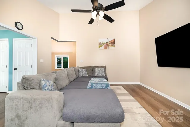 a living room with couches and a flat screen tv