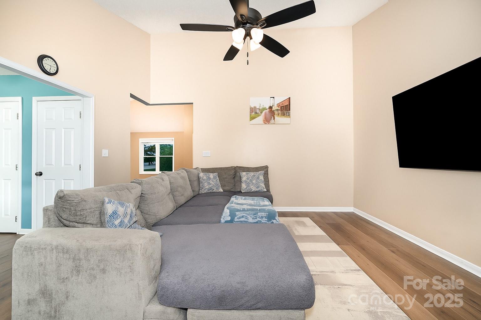 245 Castle Keep Road Salisbury, NC 28146 - Photo 7 of 26 a living room with couches and a flat screen tv