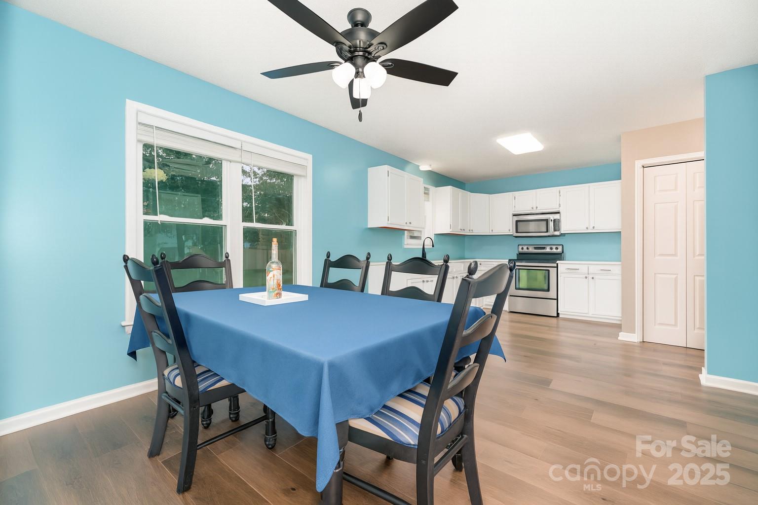 245 Castle Keep Road Salisbury, NC 28146 - Photo 10 of 26 a view of a dining room with furniture and a window