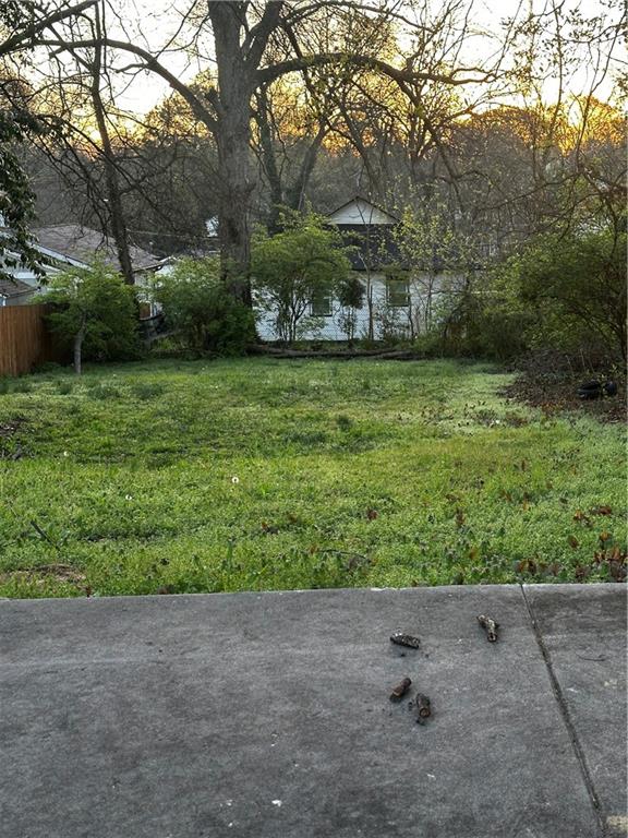 1102 Sims Street Southwest Atlanta, GA 30310 - Photo 1 of 6 a view of a yard with a tree