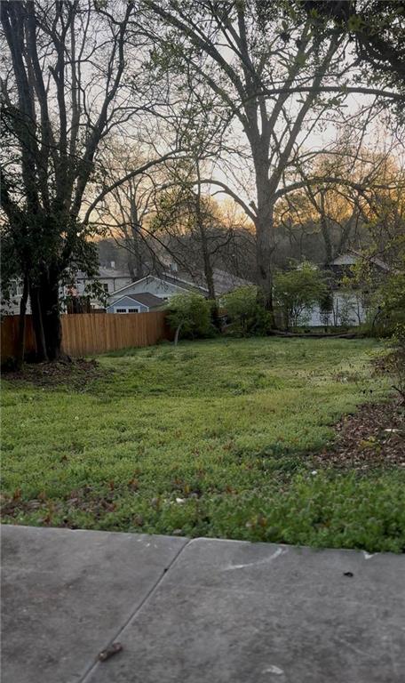 1102 Sims Street Southwest Atlanta, GA 30310 - Photo 6 of 6 a view of a backyard with large trees