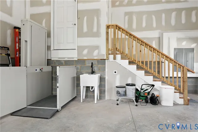 a view of staircase with white door and stairs