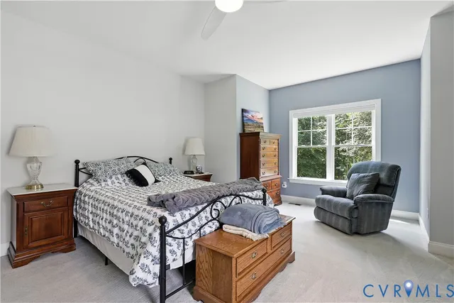 a bedroom with a bed and a couch