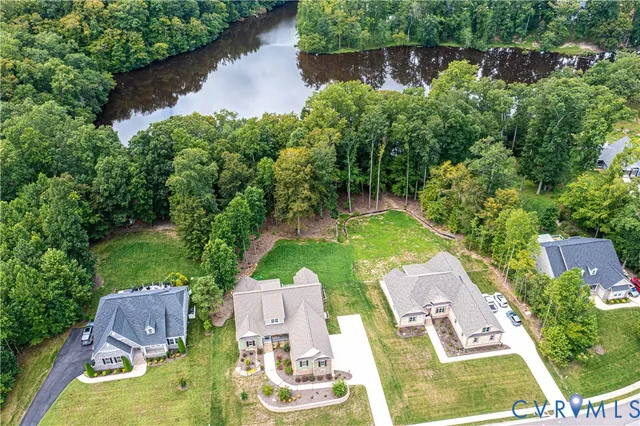 an aerial view of a house with garden space sitting space and swimming pool