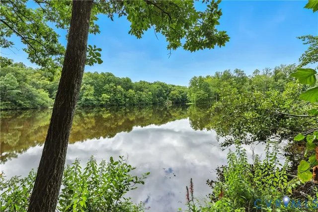 a view of a yard with a lake view