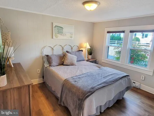 a bedroom with bed and window