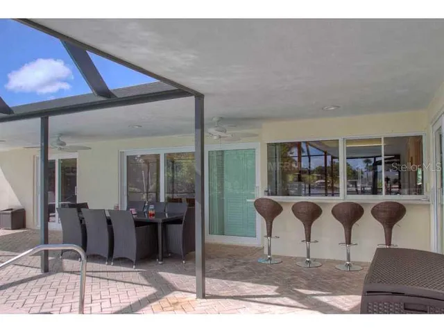 a bathroom with a granite countertop sink a mirror and a shower