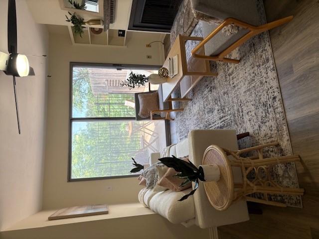 6910 Hart Lane, Unit 807 Austin, TX 78731 - Photo 14 of 36 a living room with furniture and a floor to ceiling window