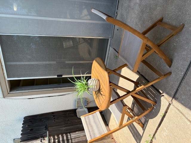 6910 Hart Lane, Unit 807 Austin, TX 78731 - Photo 18 of 36 a view of a dining room with furniture and wooden floor