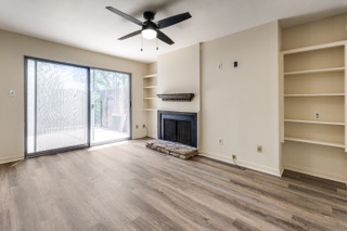 6910 Hart Lane, Unit 807 Austin, TX 78731 - Photo 3 of 36 a view of an empty room with a window and a kitchen