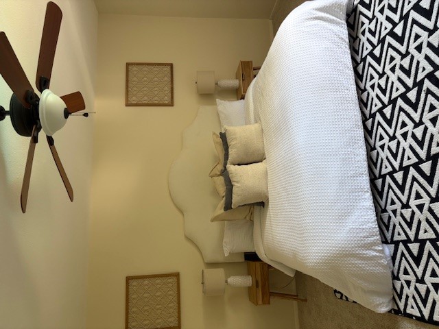 6910 Hart Lane, Unit 807 Austin, TX 78731 - Photo 28 of 36 a bedroom with a bed and wooden floor