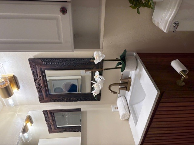 6910 Hart Lane, Unit 807 Austin, TX 78731 - Photo 31 of 36 a bathroom with a sink and a mirror