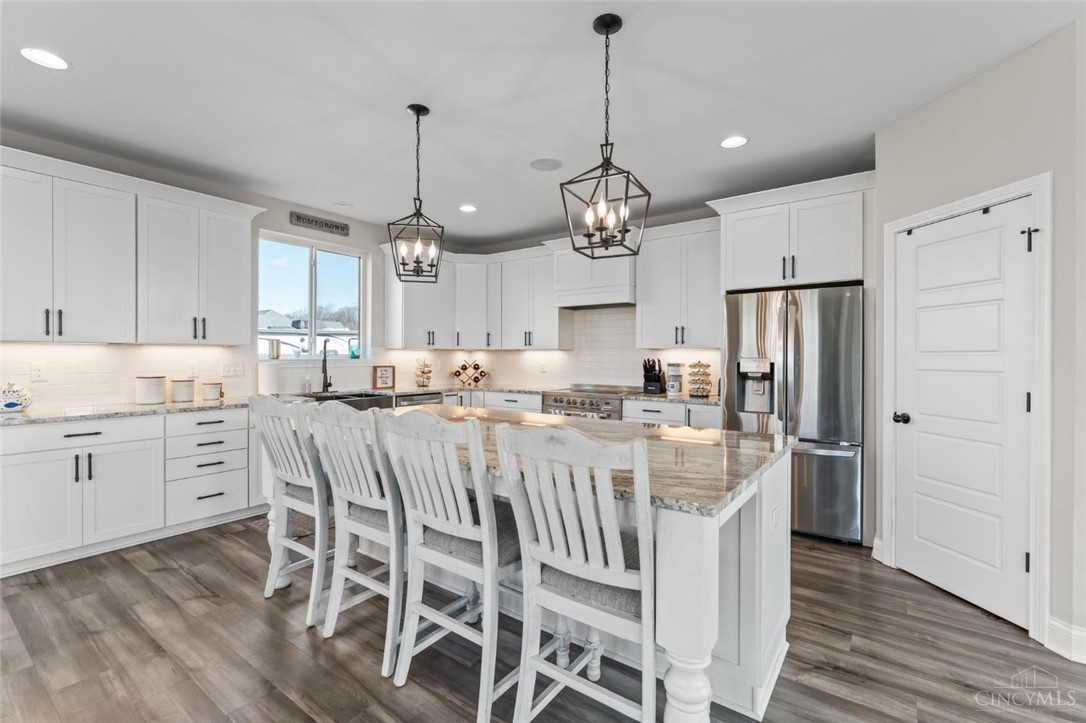 2425 Middleboro Road Clarksville, OH 45113 - Photo 36 of 91 Bright and open, this modern kitchen features an island with seating, perfect for entertaining.