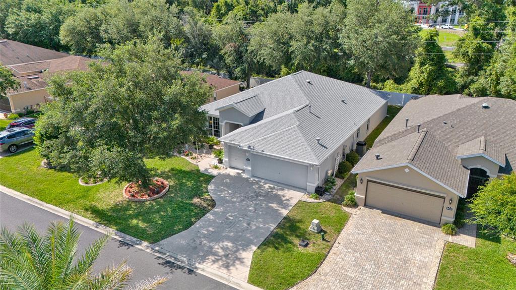 16411 Southwest 14th Avenue Road Ocala, FL 34473 - Photo 54 of 59 an aerial view of a house with a yard and greenery