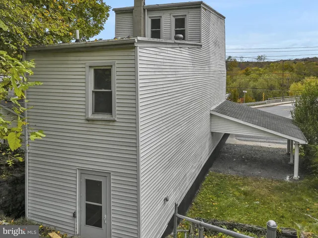 a view of a patio with a table and chairs