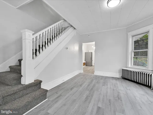 a view of entryway with wooden floor