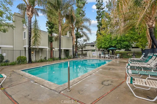 a view of swimming pool with chairs