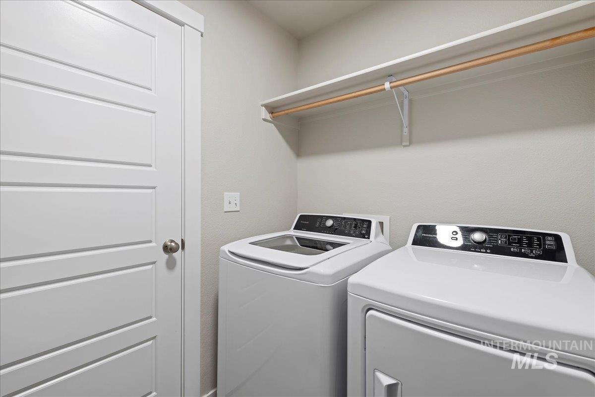 2487 East Goldstone Street Meridian, ID 83642 - Photo 18 of 25 Laundry room with washing machine and clothes dryer