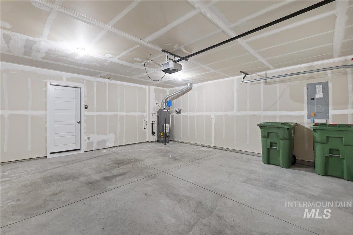 2487 East Goldstone Street Meridian, ID 83642 - Photo 20 of 25 Garage with electric panel, water heater, and a garage door opener