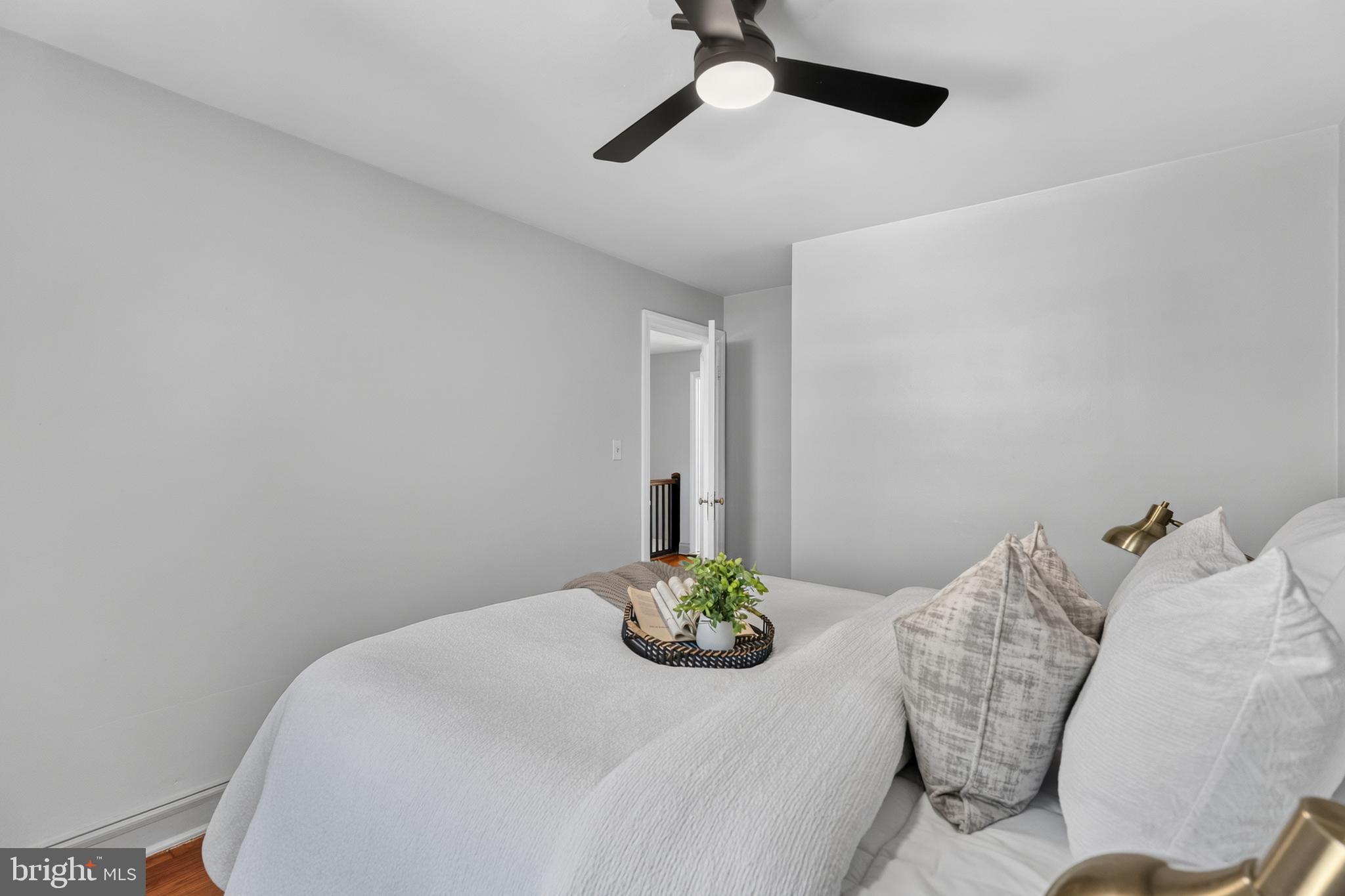 3906 Yolando Road Baltimore, MD 21218 - Photo 13 of 30 a bedroom with a bed and a chandelier