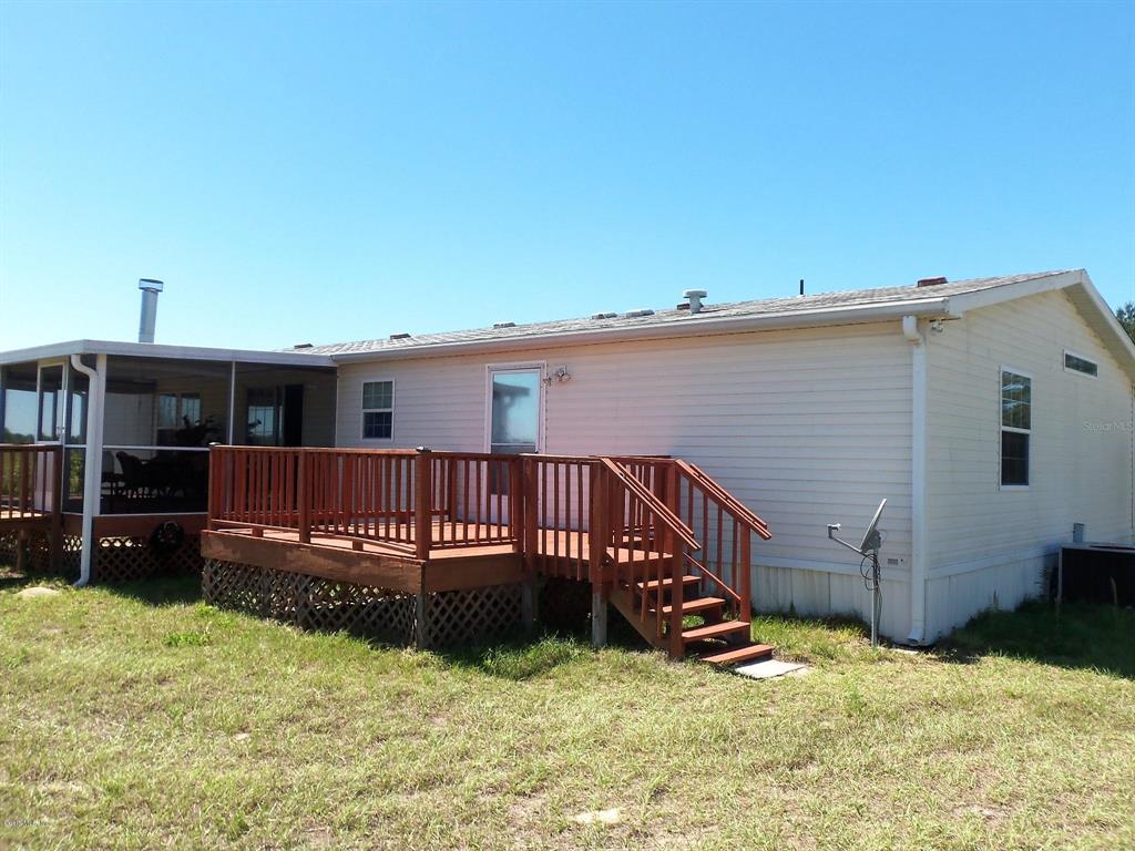 2061 Northwest 165th Ct Road Dunnellon, FL 34432 - Photo 1 of 1 a view of a house with a yard