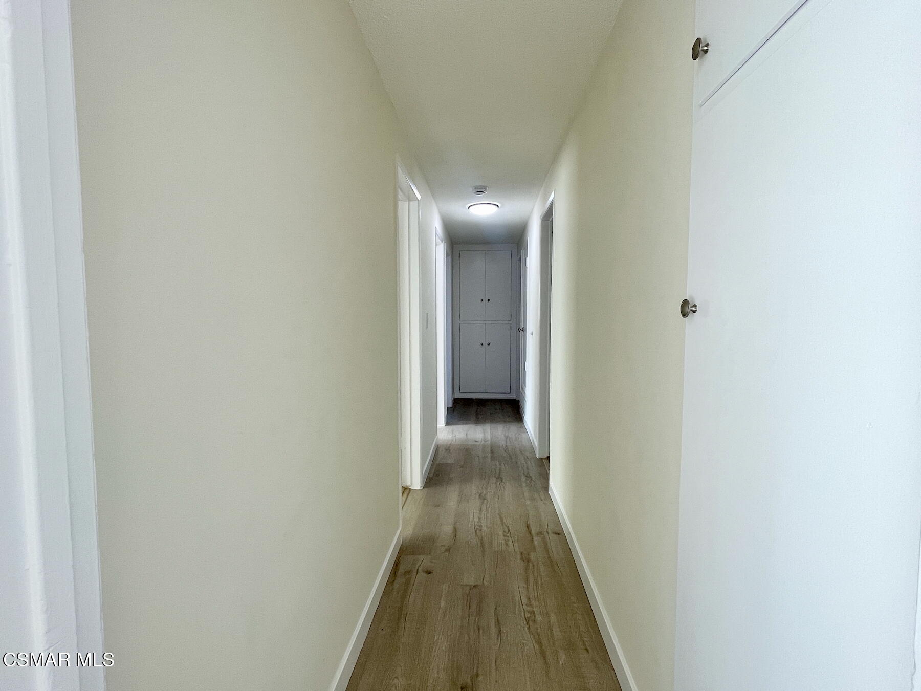 1240 Graham Street Simi Valley, CA 93065 - Photo 9 of 22 a view of a hallway with wooden floor