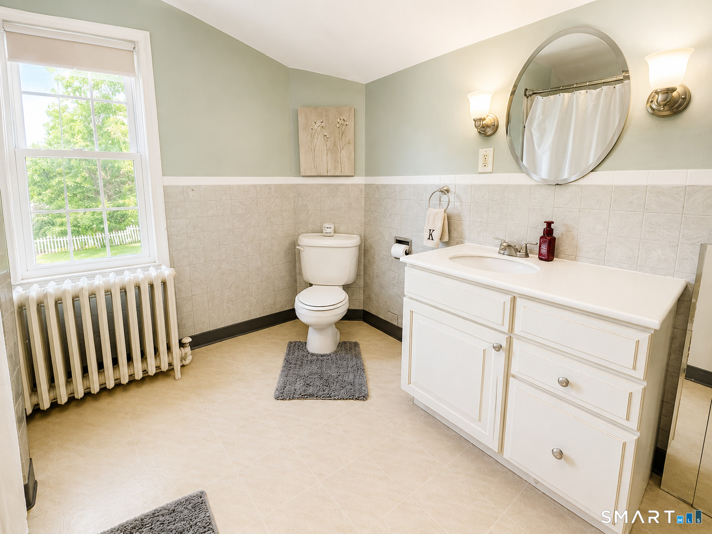 443 Amity Road Bethany, CT 06524 - Photo 25 of 30 a bathroom with a sink and a mirror