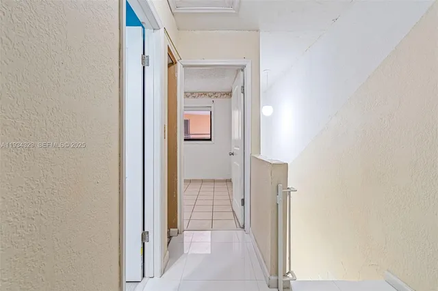 a view of a bathroom from a hallway