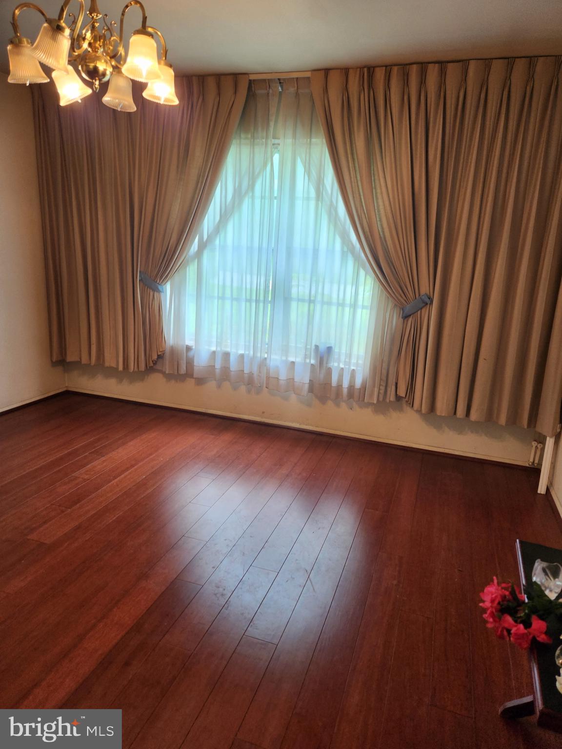7 Ridge Road Malvern, PA 19355 - Photo 11 of 16 an empty room with wooden floor and windows