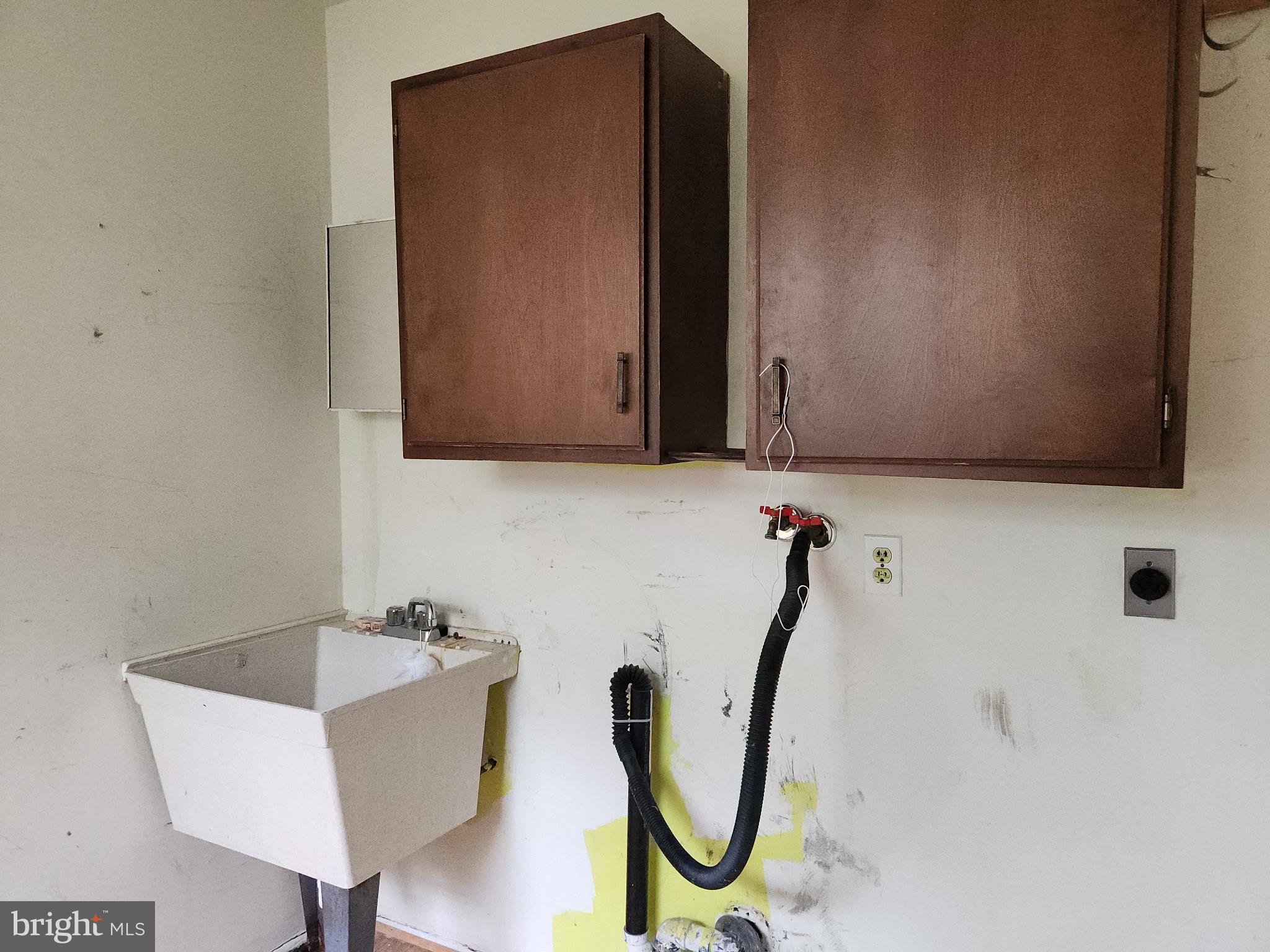 7 Ridge Road Malvern, PA 19355 - Photo 13 of 16 a bathroom with a sink a mirror and a window