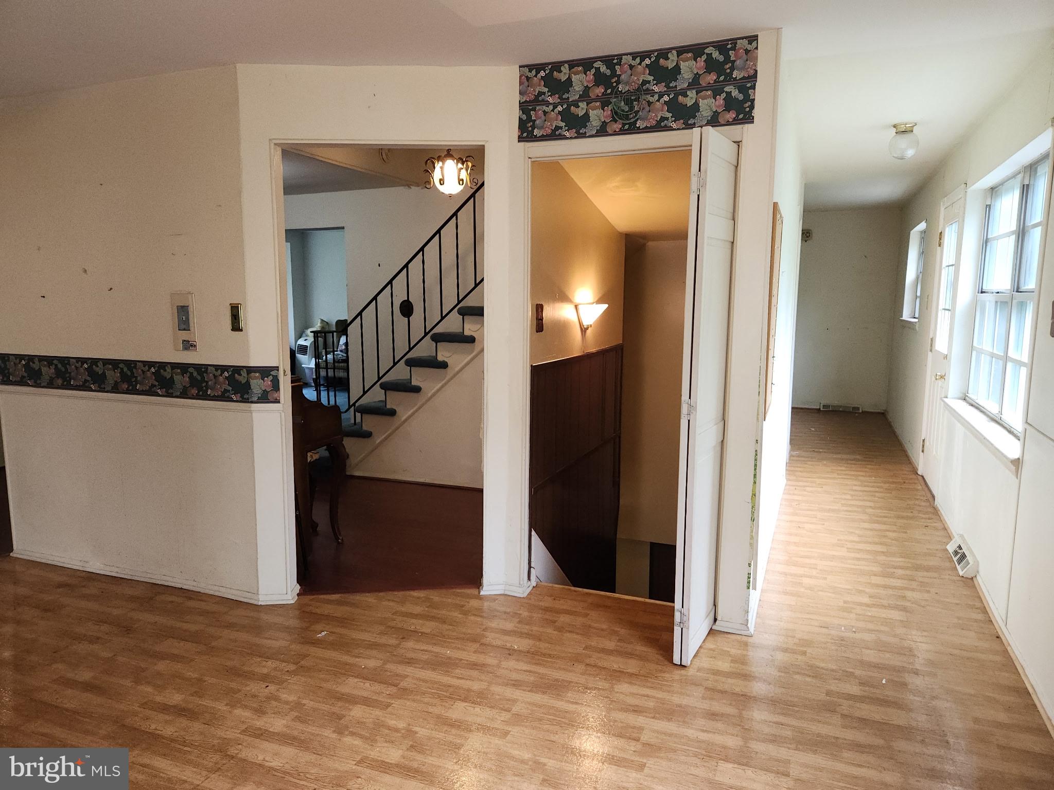 7 Ridge Road Malvern, PA 19355 - Photo 14 of 16 a view of a hallway view with wooden floor and staircase