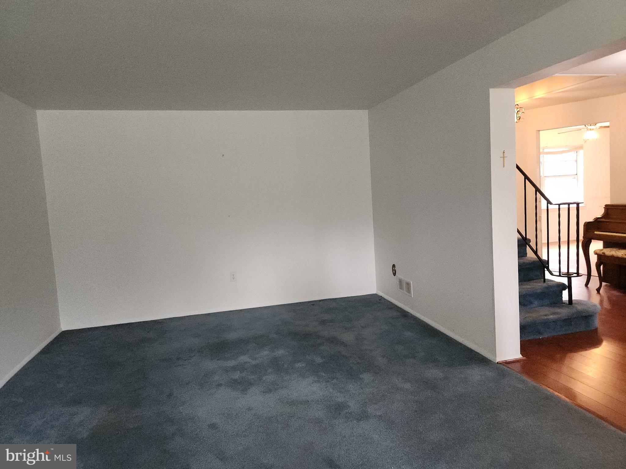 7 Ridge Road Malvern, PA 19355 - Photo 4 of 16 an empty room with wooden floor and windows