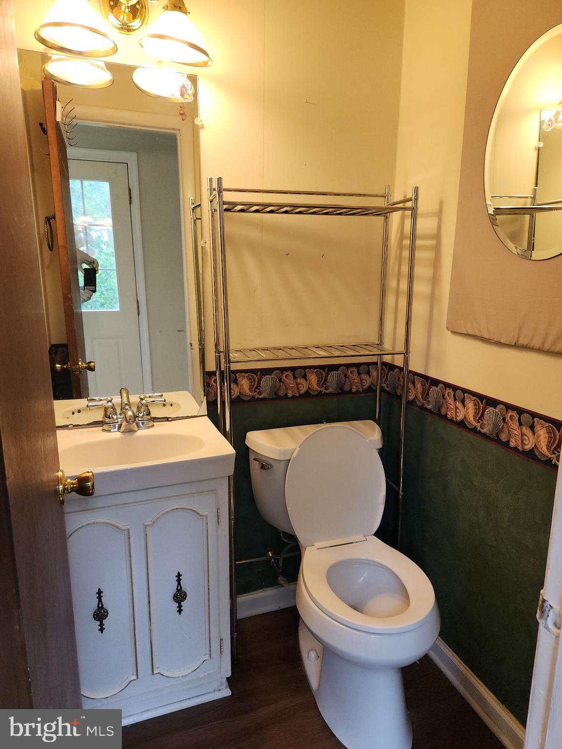 7 Ridge Road Malvern, PA 19355 - Photo 7 of 16 a bathroom with a toilet a sink and mirror