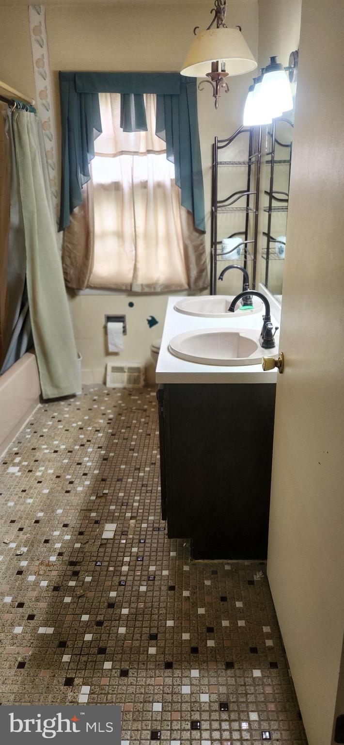 7 Ridge Road Malvern, PA 19355 - Photo 10 of 16 a bathroom with a sink and a mirror