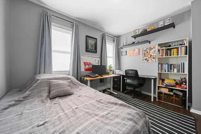 a bedroom with bed and a window