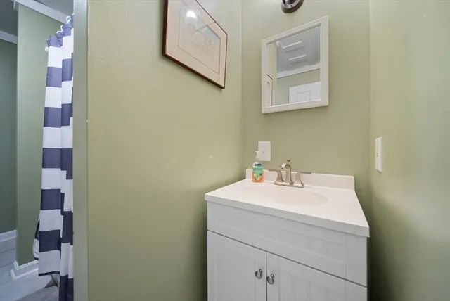a view of room with window and wooden floor