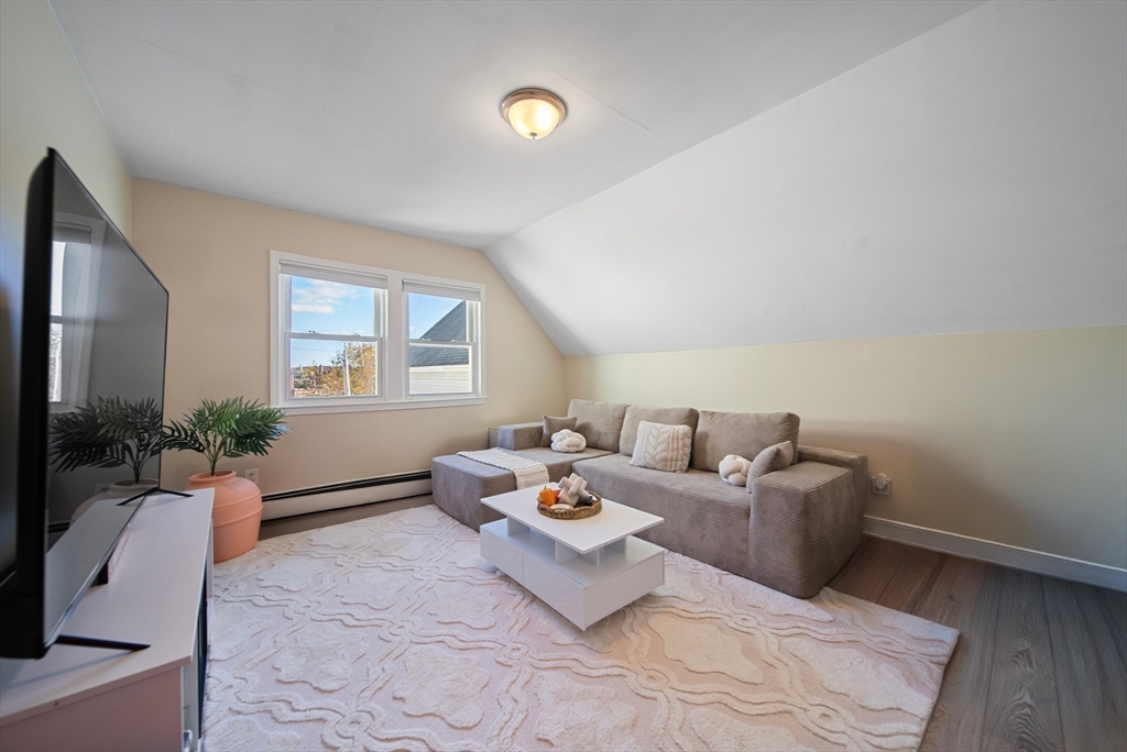 40 Bellevue Avenue Haverhill, MA 01832 - Photo 19 of 38 a living room with furniture chess table and a window
