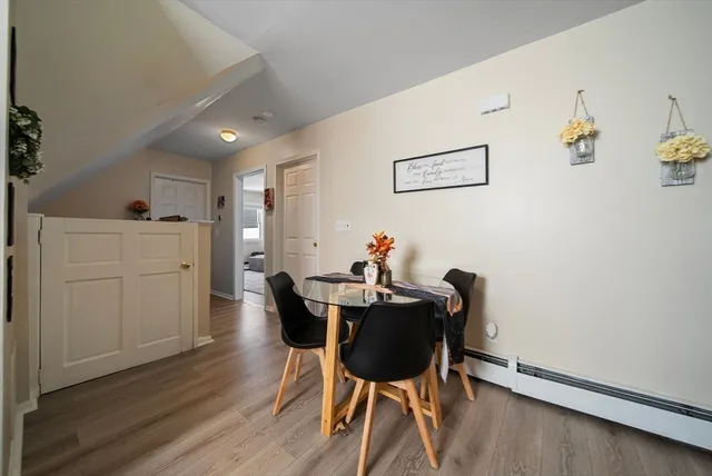 a kitchen with a refrigerator stove and white cabinets