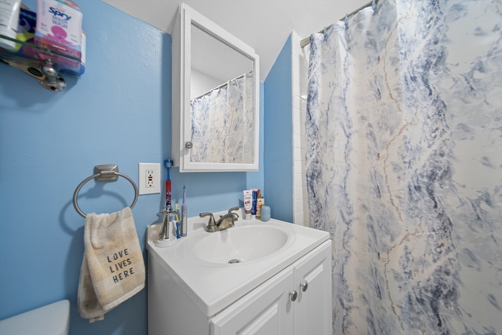 40 Bellevue Avenue Haverhill, MA 01832 - Photo 27 of 38 a bathroom with a sink and a mirror