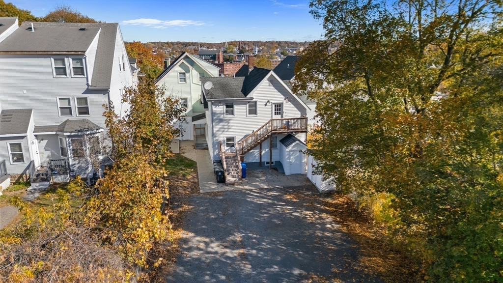 40 Bellevue Avenue Haverhill, MA 01832 - Photo 33 of 38 a view of a house with a small yard and large tree