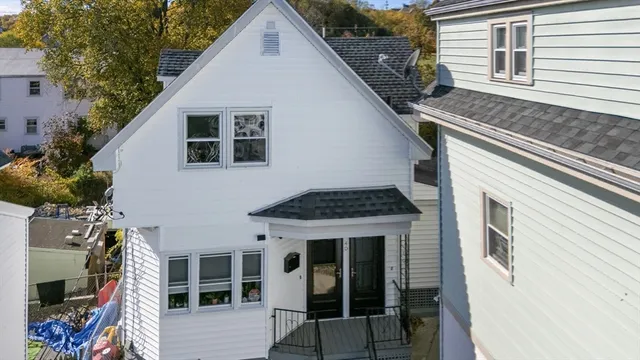 an aerial view of residential houses with outdoor space