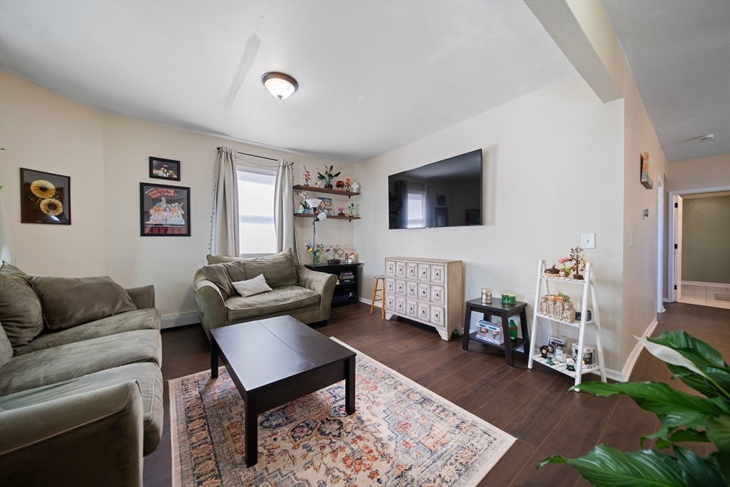 40 Bellevue Avenue Haverhill, MA 01832 - Photo 4 of 38 a living room with furniture and a flat screen tv