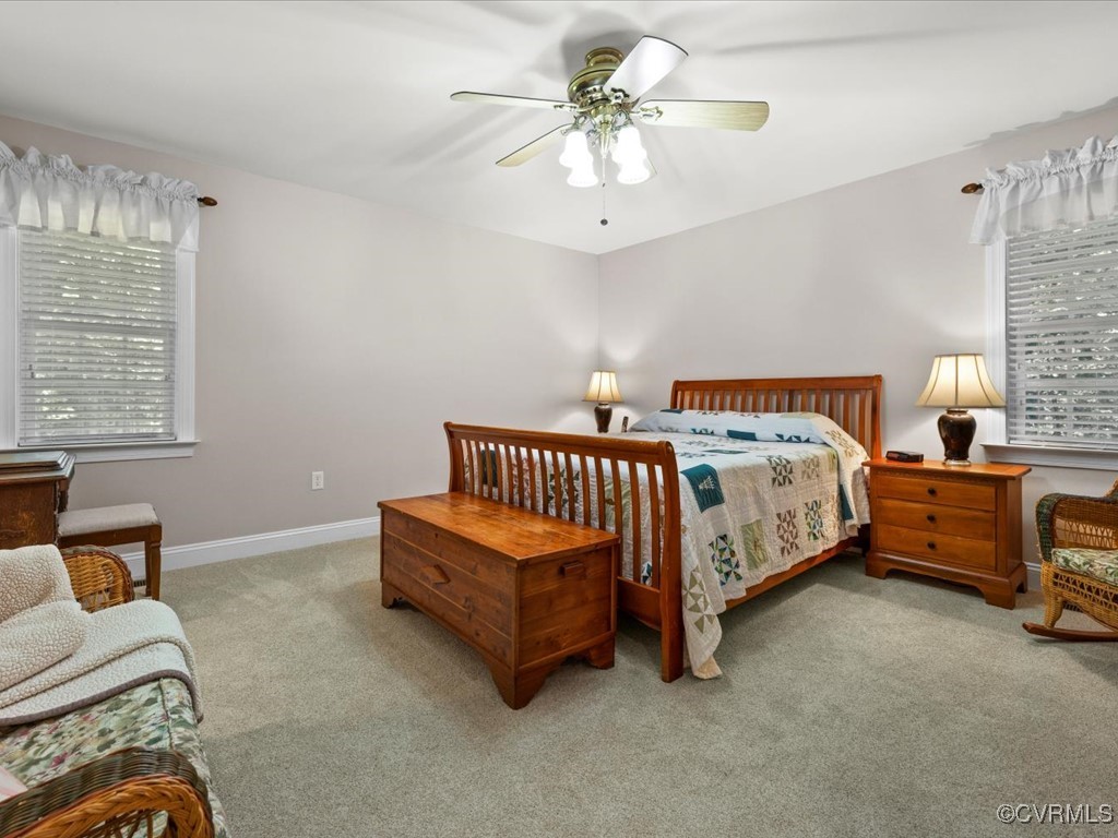 1875 Capeway Road Powhatan, VA 23139 - Photo 14 of 42 a bedroom with a bed and a chandelier