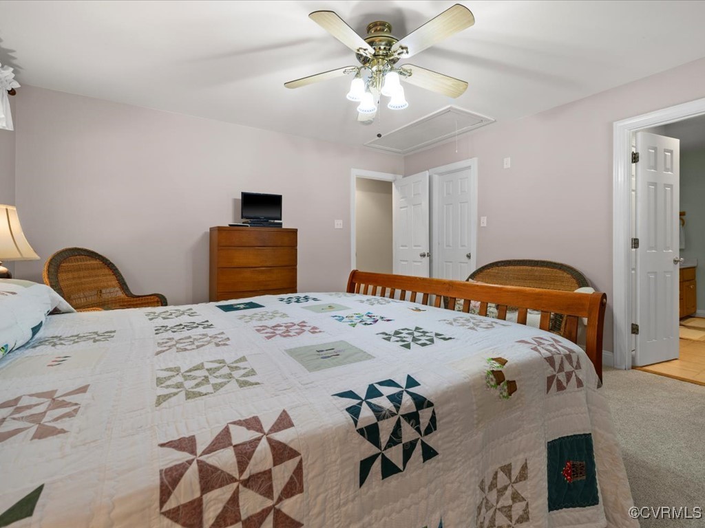 1875 Capeway Road Powhatan, VA 23139 - Photo 15 of 42 a bedroom with a bed and a chandelier