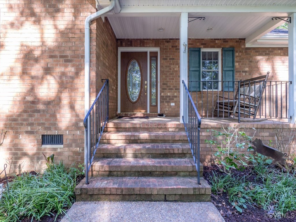 1875 Capeway Road Powhatan, VA 23139 - Photo 24 of 42 a front view of a house with potted plants